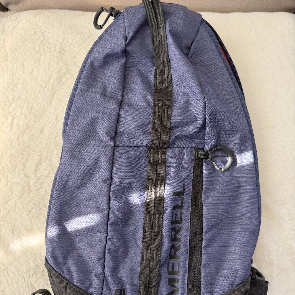 Both Merrell Crest 8L Sling Bags (one blue, one camo), both very nice!